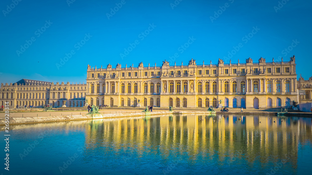 Famous palace Versailles with beautiful gardens outdoors near Paris, France. The Palace Versailles was a royal chateau and was added to the UNESCO list of World Heritage Sites. 