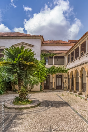 Interior view of the University of Coimbra , law department building, Melos Palace, with garden and vernacular cloister