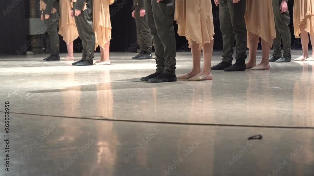 Close-up of female legs dancing cheerfully on stage. Close-up of female legs dancing cheerfully on stage.