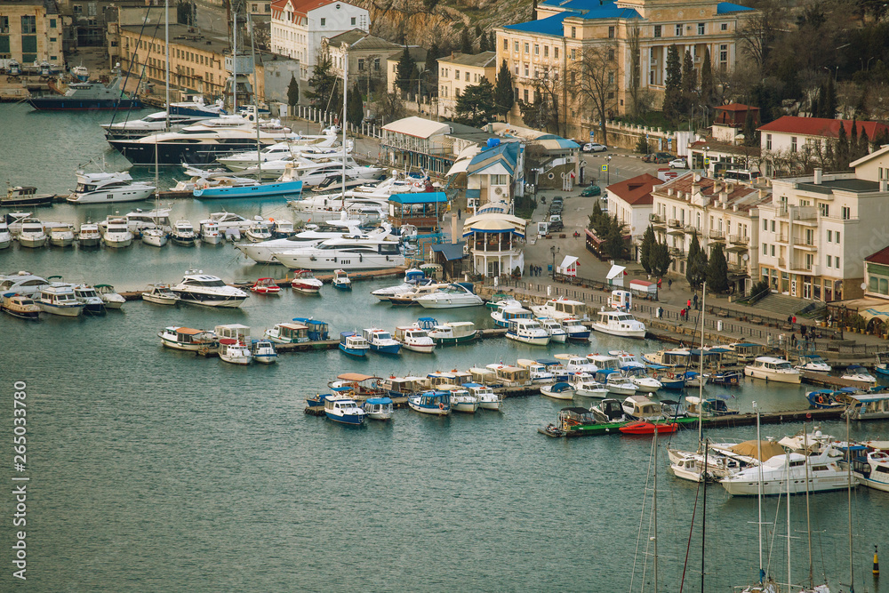 Old European town harbor or port with boats and yachts. Luxury vacation and sea travel concept