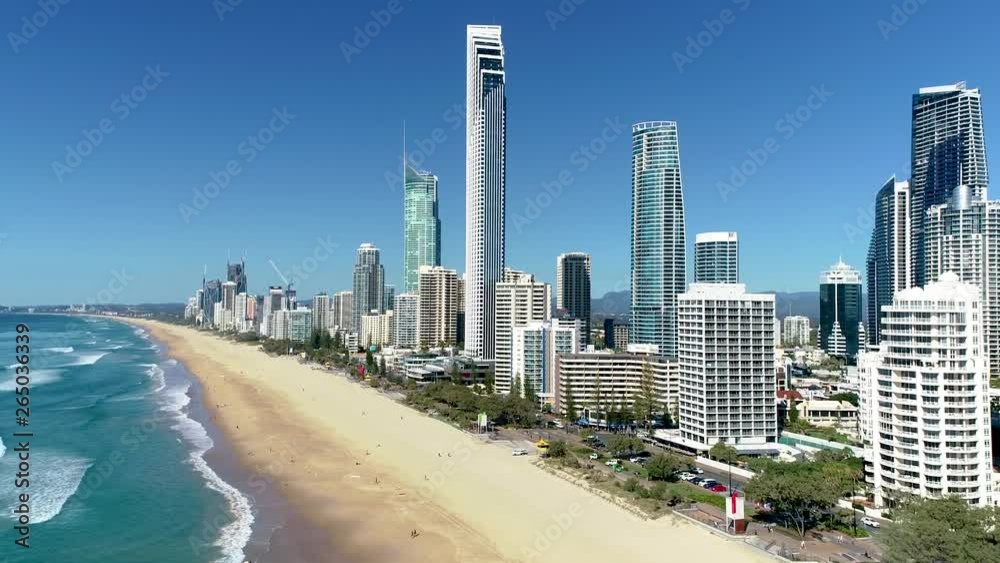 Aerial shot moving right to left, showing the skyscrapers and beaches of Surfers Paradise on a perfect blue day. Gold Coast Queensland Australia. Aerial shot moving right to left, showing the skyscrapers and beaches of Surfers Paradise on a perfect blue day. Gold Coast Queensland Australia.