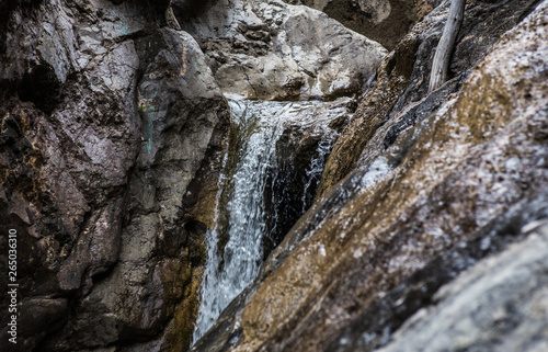 flow of water between the rocks of a mountain stream