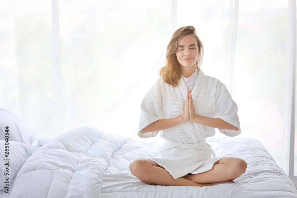 young and beautiful girl enjoying in meditates with yoga pose in bedroom young and beautiful girl enjoying in meditates with yoga pose in bedroom