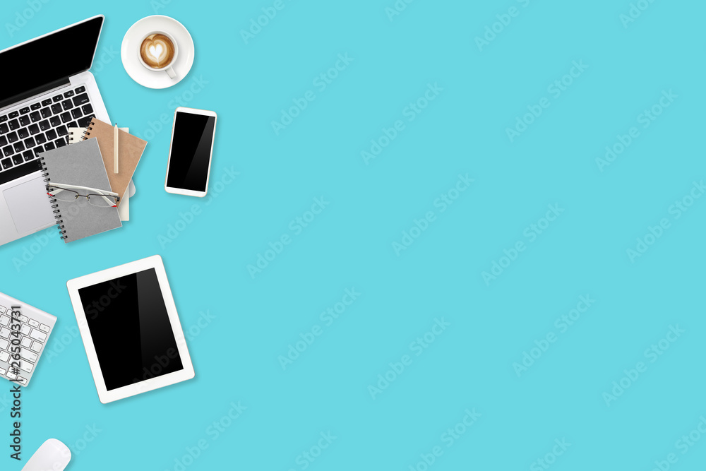 top view workspace business green and white table with laptop computer, cell phone, tablet, office supplies and coffee cup using for background top view workspace business green and white table with laptop computer, cell phone, tablet, office supplies and coffee cup using for background