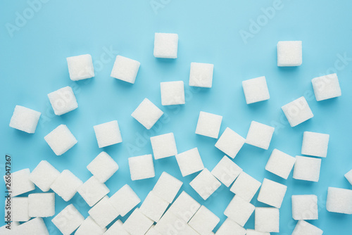 White sugar cube isolated on blue background top view food drink cooking object design