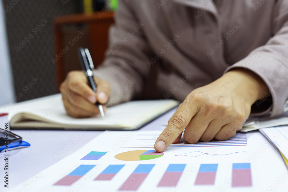 businesswomen are calculating expenses based on bill spending from preferring to go through a credit card. businesswomen are calculating expenses based on bill spending from preferring to go through a credit card.