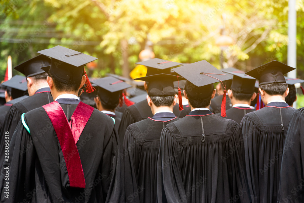 Obraz premium Back side view student graduation of graduates during commencement. Congratulation in University concept, Education concept.