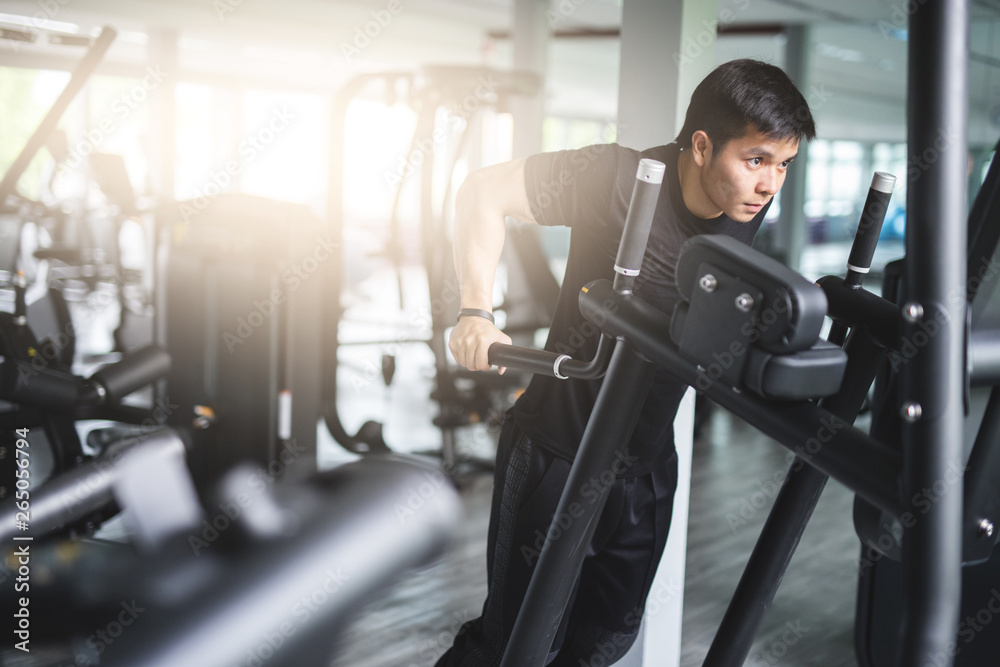 Fototapeta premium Strong man exercise in the fitness gym.