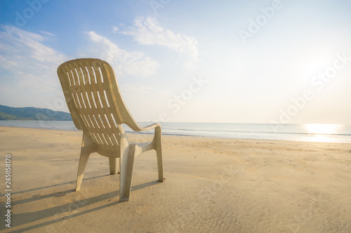 Beach chair on a beach with a view blue ocean. Summer concept, Relaxing concept © Patcharanan
