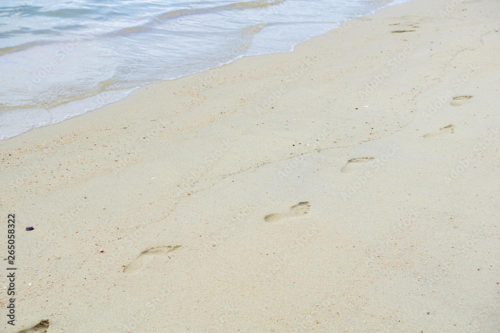 Texture footprints in the sand on the beach. Relax time concept, travel concept Texture footprints in the sand on the beach. Relax time concept, travel concept
