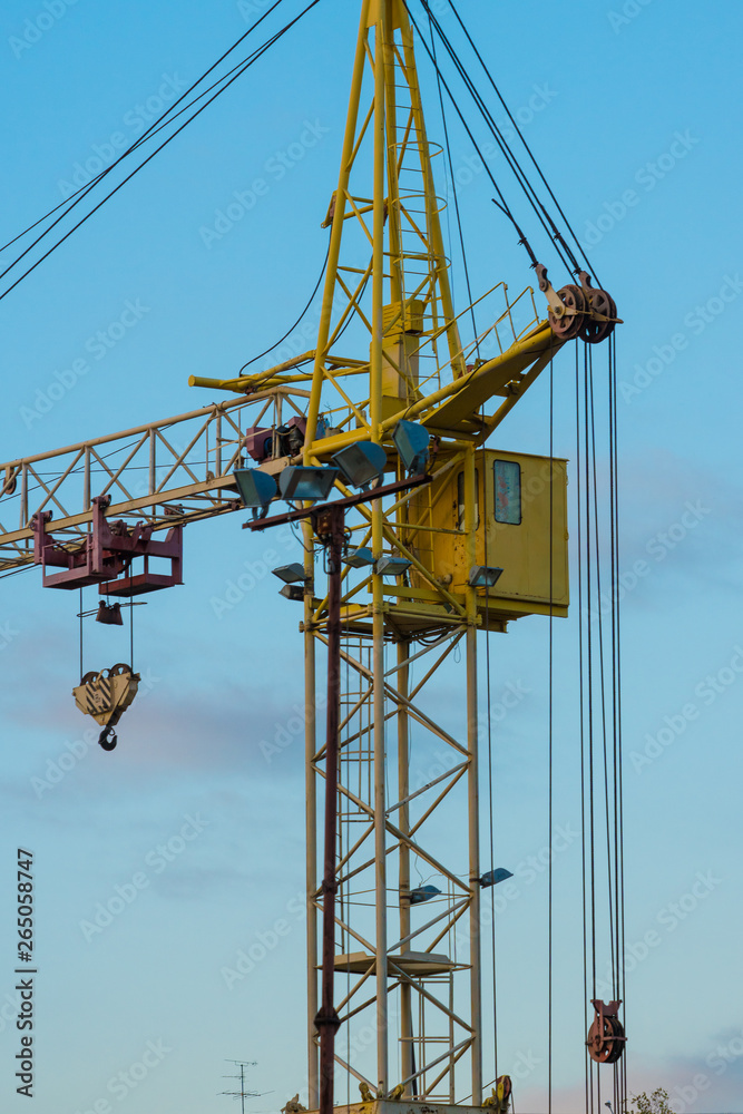building crane over clear blue sky background building crane over clear blue sky background
