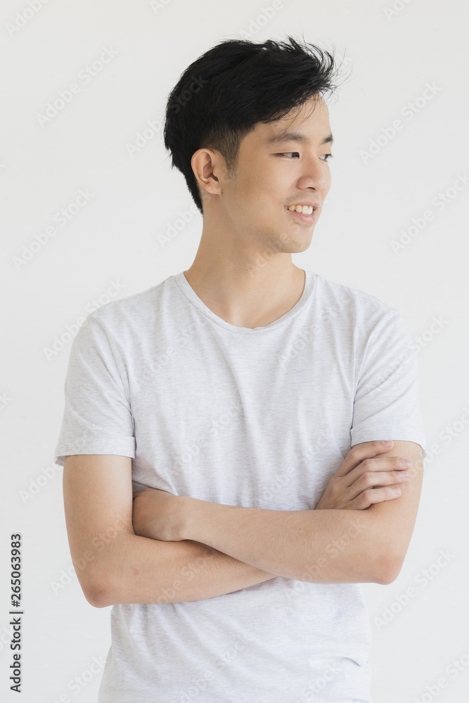 Obraz premium Young Asian man model in T-shirt crossed arm..