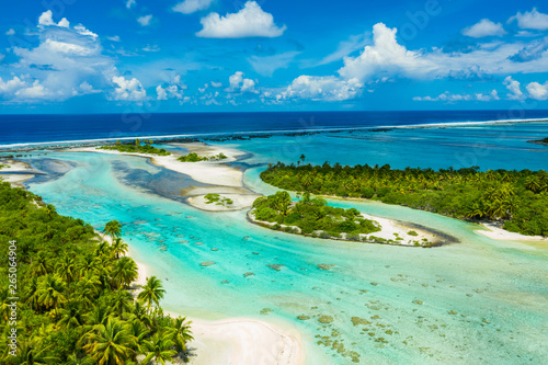 Rangiroa aerial drone video of atoll island motu and coral reef in French Polynesia, Tahiti. Amazing nature landscape with blue lagoon and Pacific Ocean. Tropical island paradise in Tuamotus Islands.