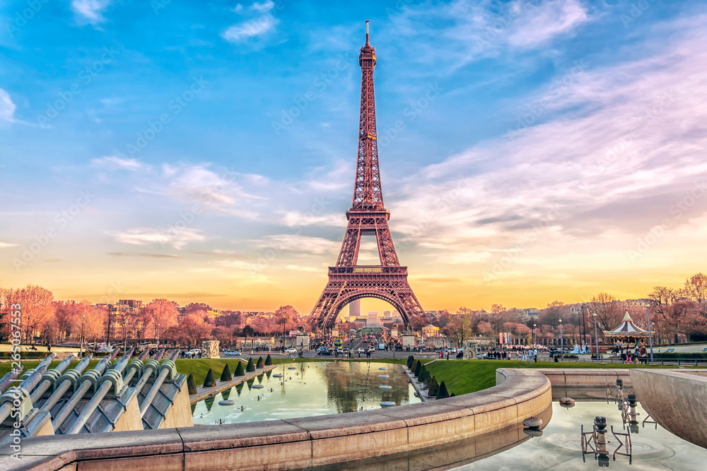 Eiffel Tower at sunset in Paris, France. Romantic travel background