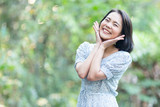 asian young woman short hair smiling in the nature background and copy space , Female smiling concept