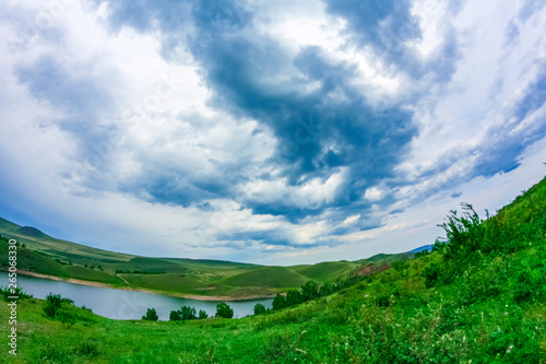 Tableau sur toile Landscape with mountains and clouds through a fisheye lens