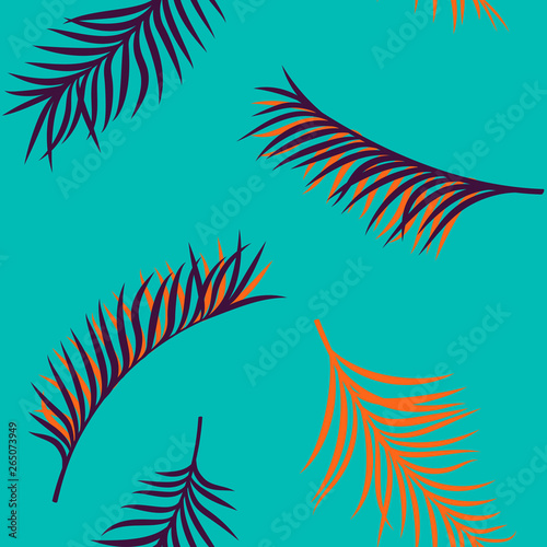 Seamless hand drawn tropical summer pattern with colorful palm leaves on a blue background photo