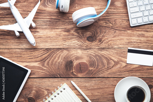 Travel items on a wooden desk. Travel and vacation. Business trip concept