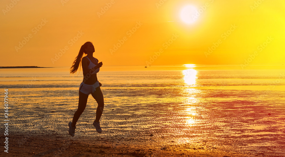 girl running by the sea on the beach