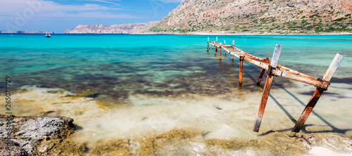 An old and rusty jetty at a bay on the island of Crete, Greece.
