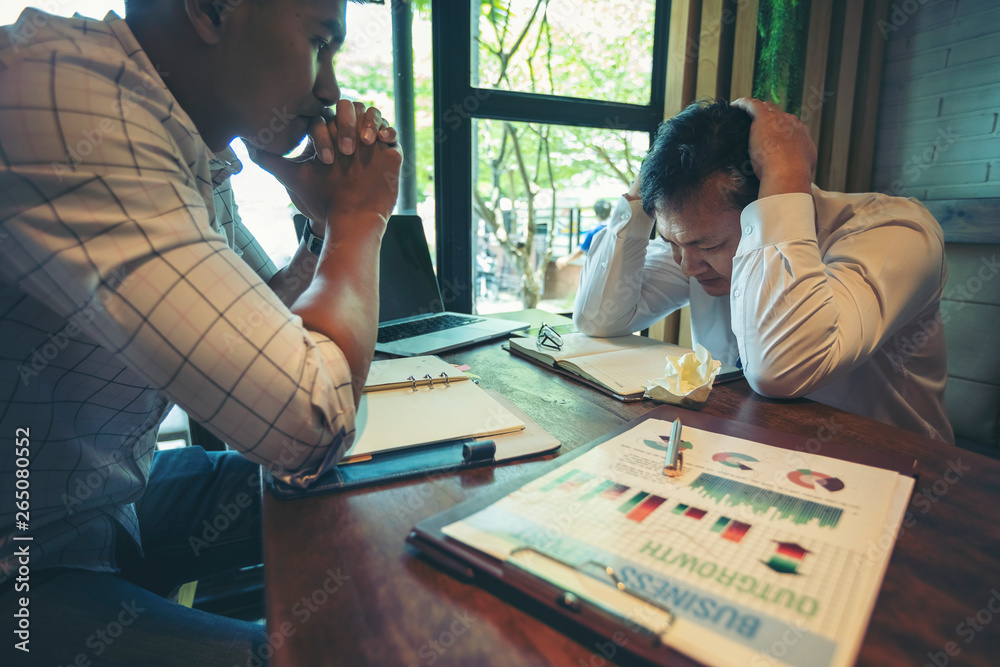 Fototapeta premium Businesspeople at business meeting making decision thinking unrecognizable businessmen sitting opposite of each other. Business negotiations with stress, motion stress.