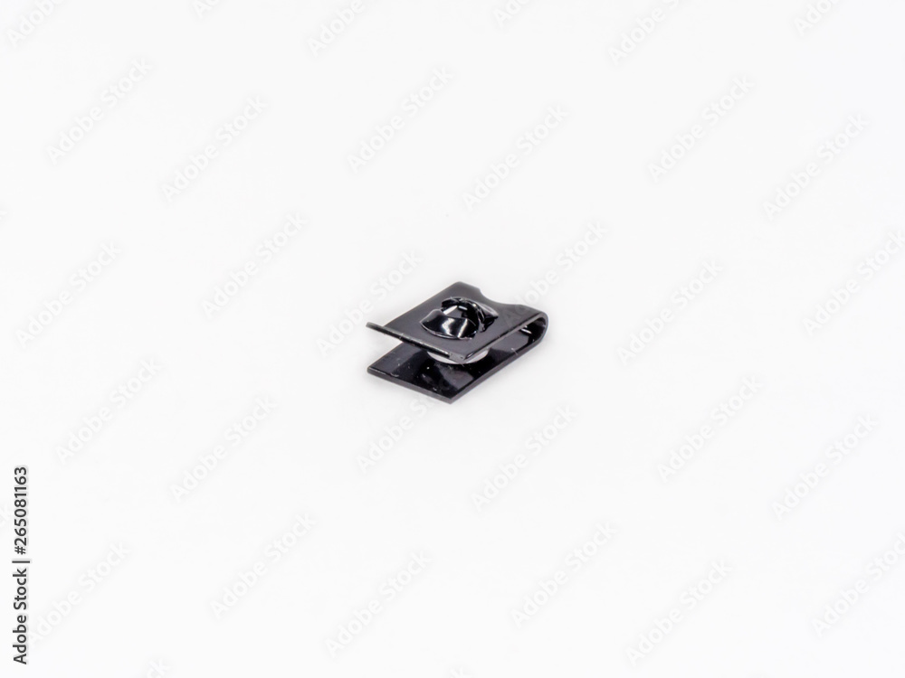 Black zinc coated spring nut for tapping screrw shot on white. Black zinc coated spring nut for tapping screrw shot on white.