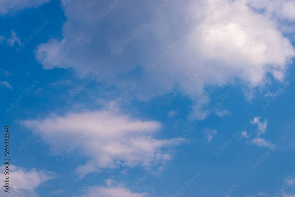 Blue sky background and white clouds soft focus, and copy space