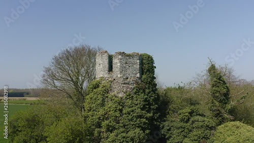 AERIAL: Circling the ruins of the Church of St Mary near Fleggburgh, reclaimed by nature, Norfolk, UK photo