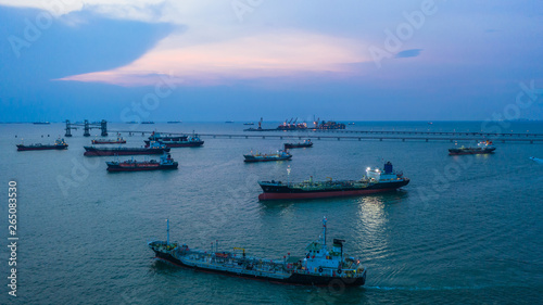 Aerial view oil / chemical tanker in open sea at night, Refinery Industry cargo ship. © Kalyakan