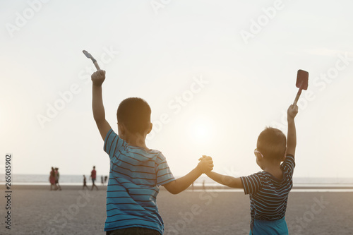 kids on the beach at sunset
