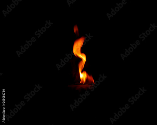 Obraz na plátně The fire that burns naturally during the night on a black background