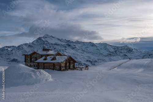 Downhill slope and apres ski mountain hut with restaurant terrace in the Italian Alps, Europe, Italy. Ski area Santa Caterina Valfurva © Сергій Вовк