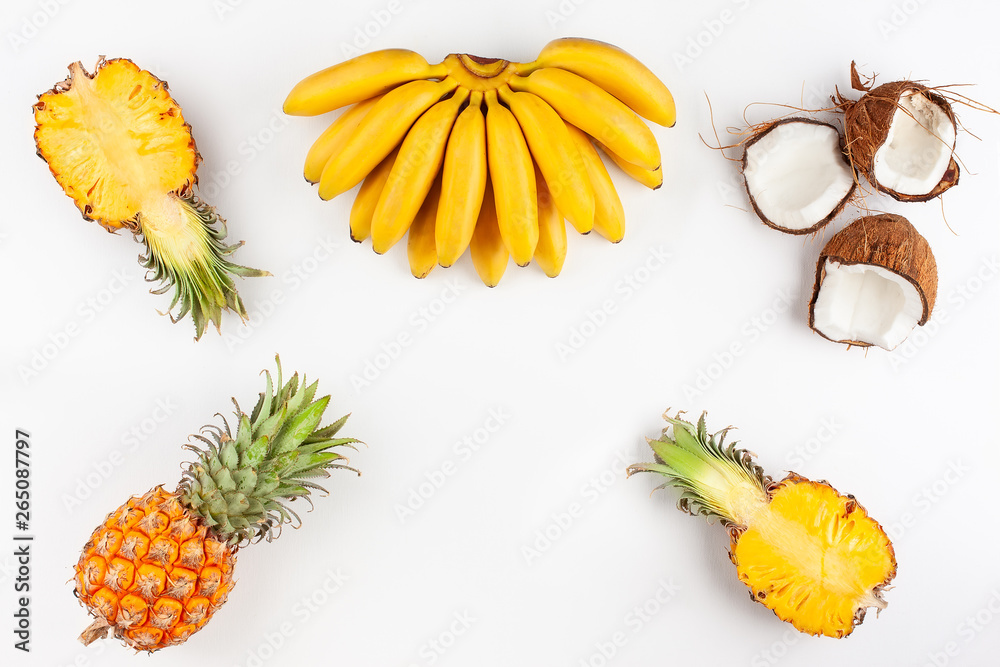 Summer composition with exotic fruits on white background.