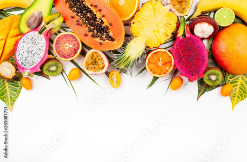 Fototapeta Naklejka Na Ścianę i Meble -  Still life with fresh assorted exotic fruits on a palm leaf.