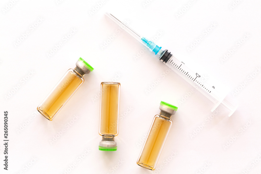 Cosmetic injections bottle - botox, filler, collagen and hyaluronic acid solution. Injection cosmetology. Healthcare, medical, pharmaceutical and beauty concept. Closeup with soft selective focus 