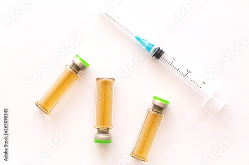 Cosmetic injections bottle - botox, filler, collagen and hyaluronic acid solution. Injection cosmetology. Healthcare, medical, pharmaceutical and beauty concept. Closeup with soft selective focus 