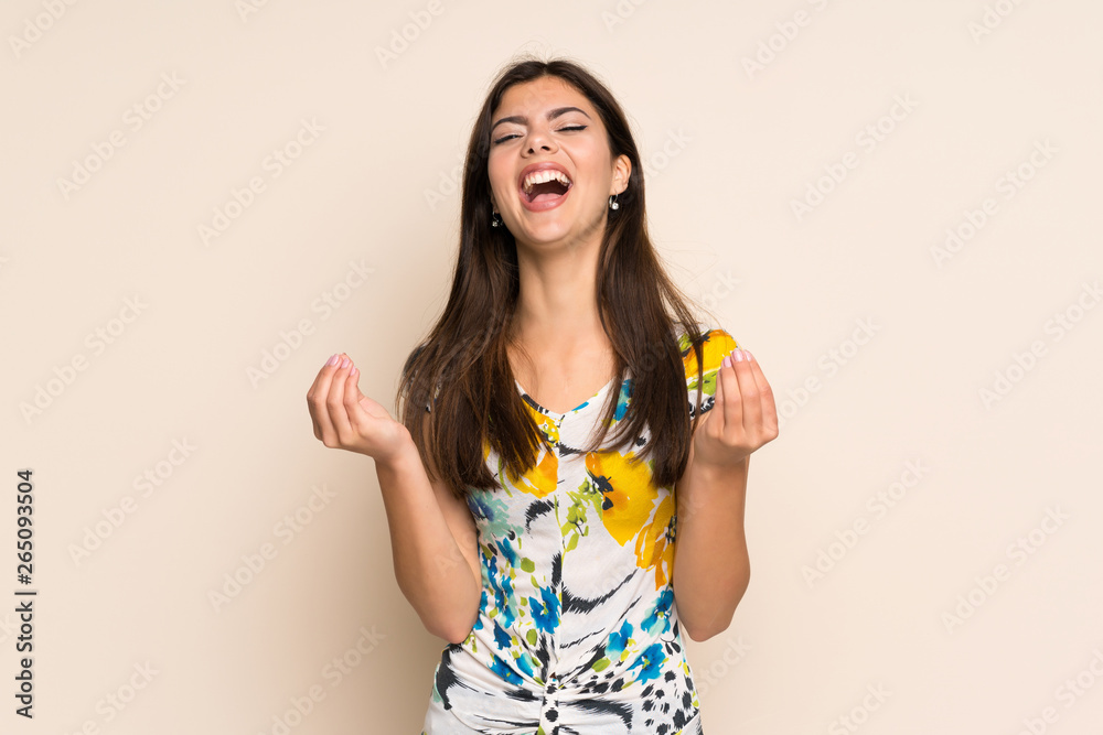 Teenager girl with floral dress making money gesture Teenager girl with floral dress making money gesture