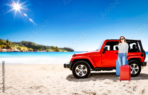 Summer time on beach and two young people with red summer car.  © magdal3na