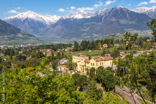 View on Castle Trauttmansdorff between a green Alps landscape and botanical garden of Meran. Merano, Province Bolzano, South Tyrol, Italy. photo