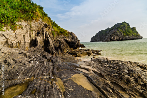 Beach rock island at Lan Ha Bay, Ha long Bay tour, Vietnam.