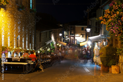 Castiglione della Pescaia  Italy - September 9  2014  People and tourist walking and have dinner at night. 