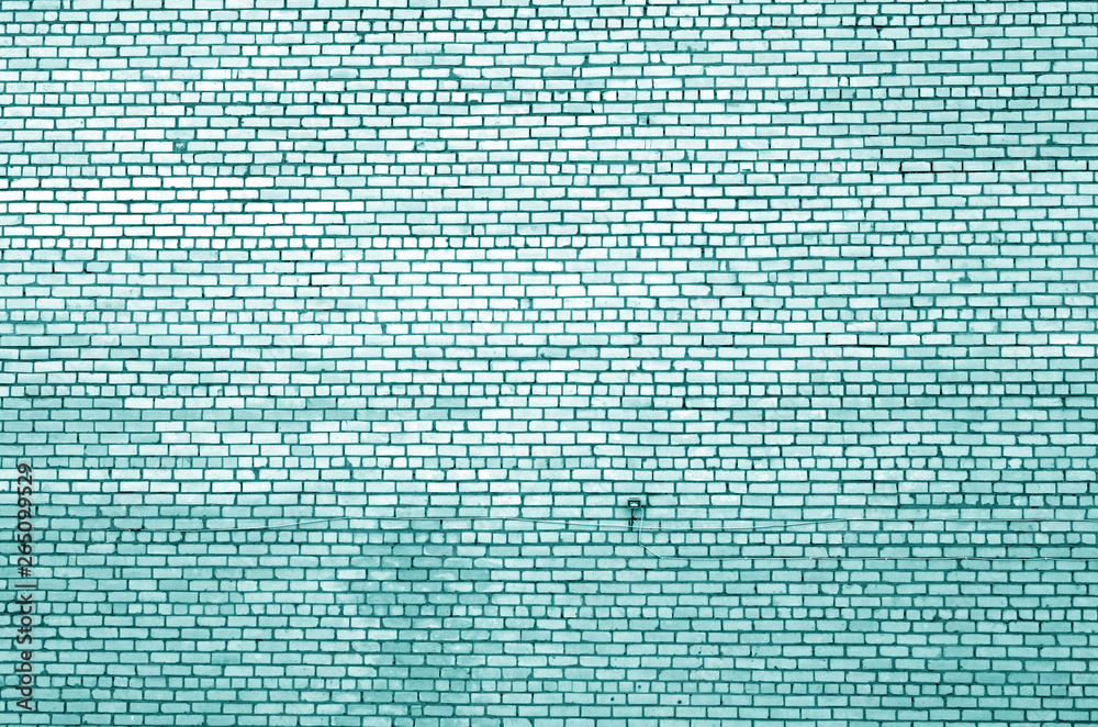 Fototapeta premium Pattern of brick wall with blur effect in cyan tone.