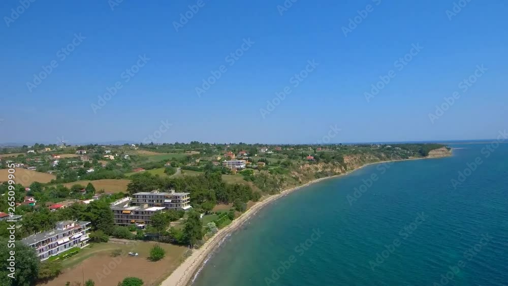 Aerial shot of beach from above with blue water, Nea Mihaniona Thessaloniki Greece, upward movement by drone Aerial shot of beach from above with blue water, Nea Mihaniona Thessaloniki Greece, upward movement by drone