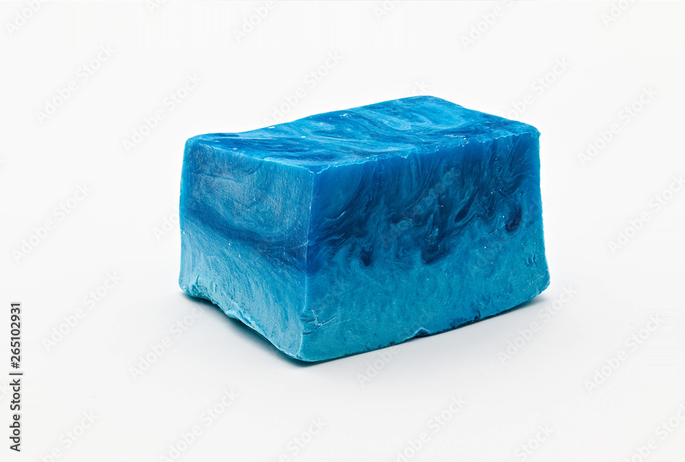 Different shades of blue natural soap bar piece on white limbo background