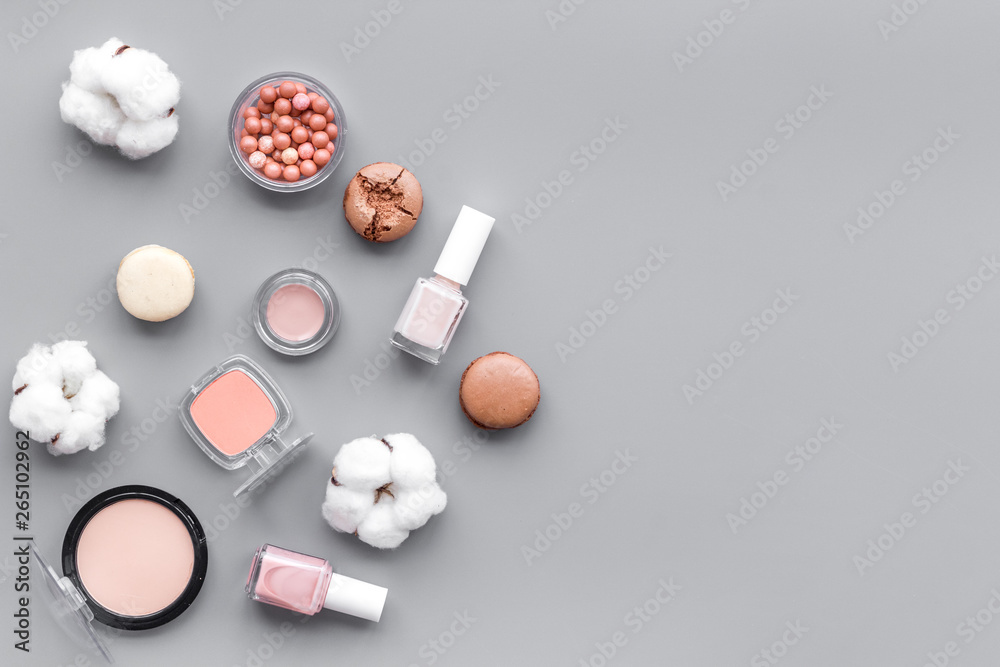 make-up accessories, fashion stylish cosmetics and macaroon on gray desk background top view copy space make-up accessories, fashion stylish cosmetics and macaroon on gray desk background top view copy space