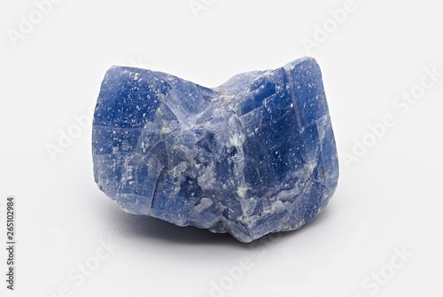 Blue shiny rough calcite mineral stone specimen isolated on white limbo background