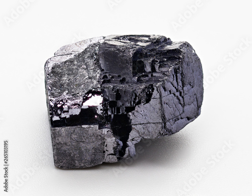 Galena, also called lead glance, is the natural mineral form of lead sulfide. Black isolated mineral rock specimen on white limbo background photo