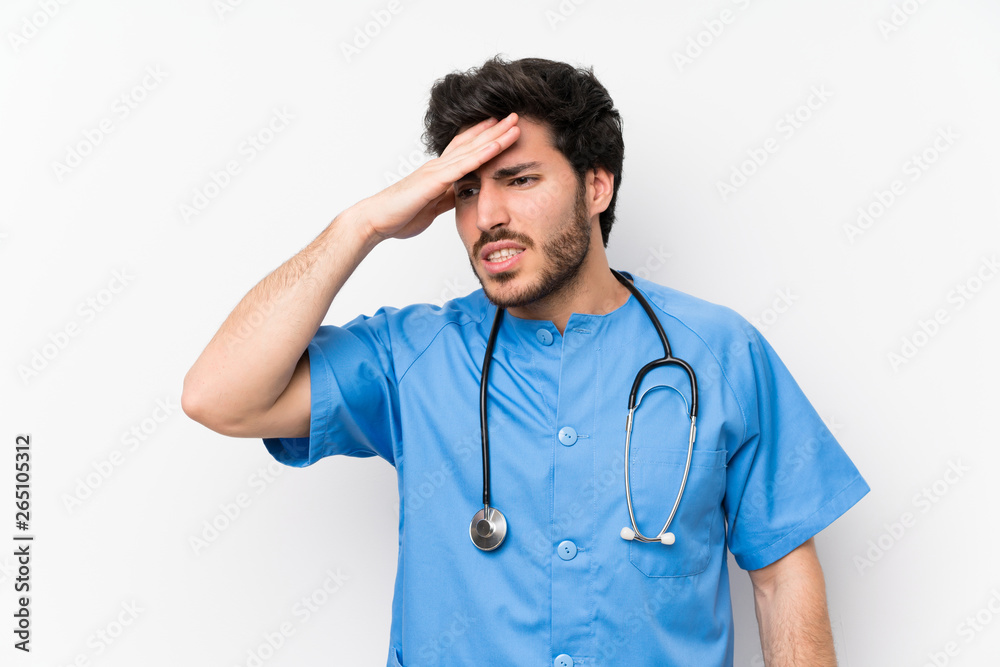 Surgeon doctor man over isolated white wall having doubts with confuse face expression Surgeon doctor man over isolated white wall having doubts with confuse face expression
