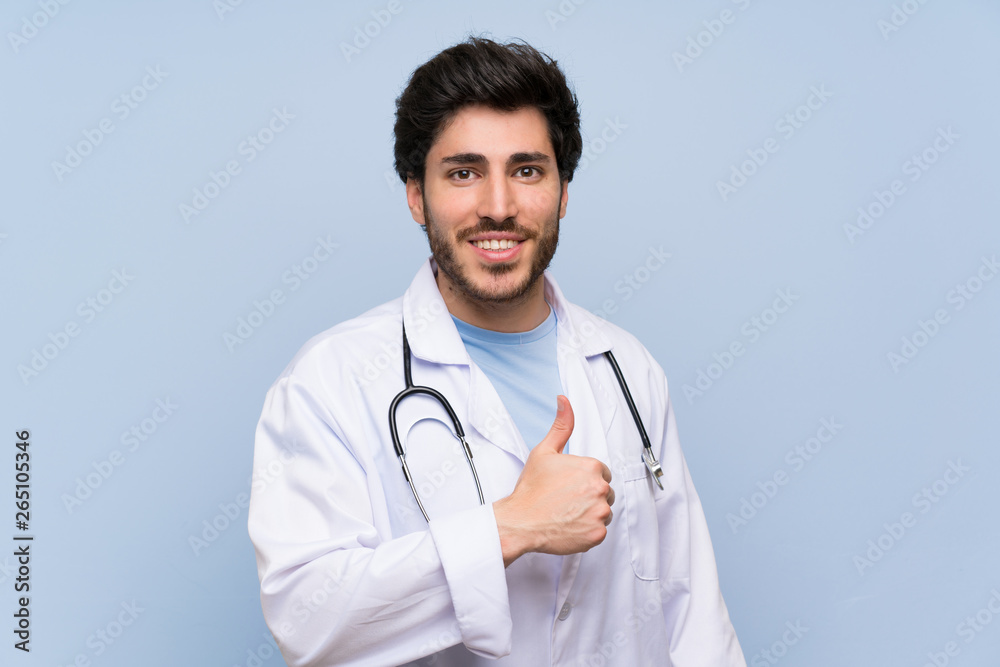 Fototapeta premium Doctor man giving a thumbs up gesture