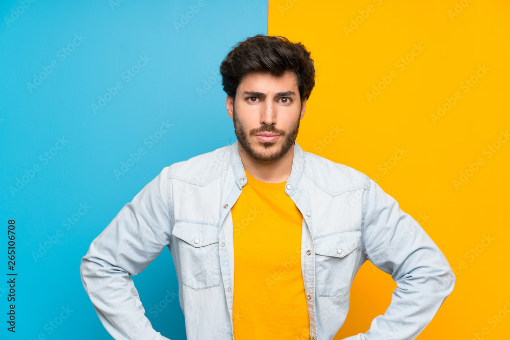 Handsome over isolated colorful background angry Handsome over isolated colorful background angry